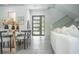 Bright and airy living room with a modern dining area and stylish decor at 2124 Clematis Pl, Sarasota, FL 34239