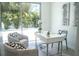 Bright home office with stylish decor and a view of lush greenery at 2124 Clematis Pl, Sarasota, FL 34239