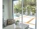 Bright and airy home office with a view of the pool and patio area at 2124 Clematis Pl, Sarasota, FL 34239