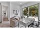 Spacious office featuring views of the pool, modern decor, and a pair of accent chairs at 2124 Clematis Pl, Sarasota, FL 34239