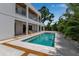 Tranquil pool area showcasing the home's modern design and serene backyard setting at 2124 Clematis Pl, Sarasota, FL 34239