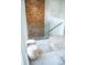 Modern staircase features a wooden accent wall, glass railing, and stylish steps at 2124 Clematis Pl, Sarasota, FL 34239
