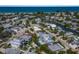 Beautiful aerial view of coastal neighborhood with waterfront homes and lush landscaping near the ocean at 227 S Harbor Dr, Holmes Beach, FL 34217