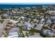 Waterfront homes near the beach and bay are displayed in this full aerial view at 227 S Harbor Dr, Holmes Beach, FL 34217