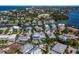 Expansive aerial view featuring modern homes, scenic waterways, and proximity to the beach at 227 S Harbor Dr, Holmes Beach, FL 34217