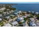 Aerial view of luxurious waterfront homes, with pools, docks, and lush greenery at 227 S Harbor Dr, Holmes Beach, FL 34217