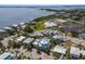 Aerial shot showcases waterfront homes with boat docks, lush vegetation, and stunning ocean views at 227 S Harbor Dr, Holmes Beach, FL 34217