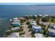 An aerial view of waterfront homes, docks, and a road, showcasing the coastal community at 227 S Harbor Dr, Holmes Beach, FL 34217