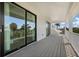 Spacious balcony with white railing provides stunning views of tropical landscape at 227 S Harbor Dr, Holmes Beach, FL 34217
