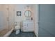 Modern bathroom features a glass-enclosed shower, stylish vanity, and trendy hexagon tile floor at 227 S Harbor Dr, Holmes Beach, FL 34217