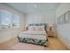 Bright bedroom showcases a unique headboard, soft lighting, and stylish decor at 227 S Harbor Dr, Holmes Beach, FL 34217