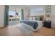 Bright bedroom with balcony access, white trim, and lovely matching side tables at 227 S Harbor Dr, Holmes Beach, FL 34217