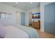 Cozy bedroom featuring a comfortable bed, modern furniture, and a mounted television at 227 S Harbor Dr, Holmes Beach, FL 34217