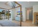 Relaxing bedroom featuring beautiful wood floors, TV, and four poster bed frame at 227 S Harbor Dr, Holmes Beach, FL 34217