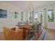 Elegant dining room features a large table with seating for eight and bright, natural light at 227 S Harbor Dr, Holmes Beach, FL 34217