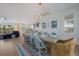 Inviting dining area flowing into an open-concept kitchen and living space for easy entertaining at 227 S Harbor Dr, Holmes Beach, FL 34217