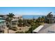 Beautiful exterior view of a home near the ocean, complemented by lush tropical landscaping at 227 S Harbor Dr, Holmes Beach, FL 34217