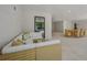 Stylish indoor living area with a comfortable sectional sofa and a dining area, with a view of the pool at 227 S Harbor Dr, Holmes Beach, FL 34217