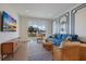 Cozy living room with designer furniture, stylish decor, and balcony access at 227 S Harbor Dr, Holmes Beach, FL 34217