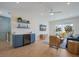 Bright living room features a beverage center, herringbone floors, and access to a private balcony at 227 S Harbor Dr, Holmes Beach, FL 34217