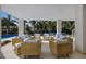 Luxurious outdoor patio with comfortable seating arranged for socializing, overlooking the pool at 227 S Harbor Dr, Holmes Beach, FL 34217