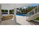 Inviting outdoor living space featuring comfortable seating and direct access to the pool and hot tub at 227 S Harbor Dr, Holmes Beach, FL 34217