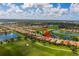 Spacious golf community, lush landscaping, and serene water views at 234 Padova Way, North Venice, FL 34275