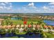 Stunning aerial view of a residential area featuring picturesque lakes, a golf course, and beautiful single-Gathering homes at 234 Padova Way, North Venice, FL 34275