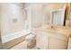Bathroom featuring a shower/tub combo, white vanity, and tile flooring at 234 Padova Way, North Venice, FL 34275