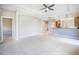 Spacious open-plan living area boasts tile floors, neutral paint, arched doorways, and an inviting kitchen at 234 Padova Way, North Venice, FL 34275