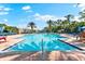 Inviting pool featuring crystal-clear water, spacious deck with lounge chairs and lush tropical landscaping at 234 Padova Way, North Venice, FL 34275