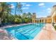 Enjoy a swim in this community pool with beautiful landscaping and building details at 234 Padova Way, North Venice, FL 34275