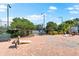Outdoor recreation area with tennis court access and relaxing lounge space for residents at 234 Padova Way, North Venice, FL 34275