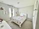 This bedroom showcases playful decor, a window for natural light, and soft carpeting at 2425 Maclachlan St, Port Charlotte, FL 33953