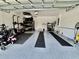 Spacious two car garage with finished floors, ample storage, and a roll up door at 2425 Maclachlan St, Port Charlotte, FL 33953