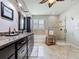 Well-lit bathroom offers a glass shower, soaking tub, and granite countertop vanity for a luxurious feel at 336 165Th Ne Ct, Bradenton, FL 34212