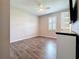 Inviting bedroom features hardwood floors, plantation shutters, and abundant natural light creating a cozy space at 336 165Th Ne Ct, Bradenton, FL 34212