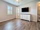 Comfortable bedroom features hardwood flooring and a closet door providing natural light and an airy feel at 336 165Th Ne Ct, Bradenton, FL 34212