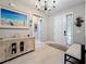 Inviting entryway featuring light wood floors, decor, and a white front door at 336 165Th Ne Ct, Bradenton, FL 34212