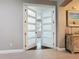 Elegant glass paneled double doors offering an open view into another room at 336 165Th Ne Ct, Bradenton, FL 34212