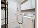 Functional laundry area equipped with modern appliances and ample cabinet storage at 336 165Th Ne Ct, Bradenton, FL 34212