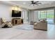 Bright living room with sliding glass doors to the pool area and comfortable seating at 336 165Th Ne Ct, Bradenton, FL 34212