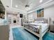 Bright primary bedroom with a large bed, accent art, and an ensuite bathroom at 336 165Th Ne Ct, Bradenton, FL 34212