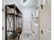 Practical mud room with storage options, laundry appliances and neutral walls at 336 165Th Ne Ct, Bradenton, FL 34212