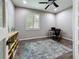 A well-lit office space featuring a desk, bookshelf, and dark wood flooring at 336 165Th Ne Ct, Bradenton, FL 34212