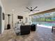 Screened-in patio features comfortable seating with pool views, creating an ideal space for outdoor entertaining at 336 165Th Ne Ct, Bradenton, FL 34212