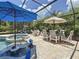 Inviting pool and spa area with comfortable seating inside a screened-in lanai for relaxed outdoor living at 336 165Th Ne Ct, Bradenton, FL 34212
