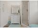 Clean bathroom with a white vanity, large mirror, and a glass-enclosed shower stall at 336 Highland Shores Dr, Ellenton, FL 34222