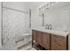 Bright bathroom featuring a vanity with stylish fixtures and a shower with a marble-patterned curtain at 336 Highland Shores Dr, Ellenton, FL 34222
