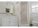Bright bathroom featuring a white vanity and shower with a glass door at 336 Highland Shores Dr, Ellenton, FL 34222